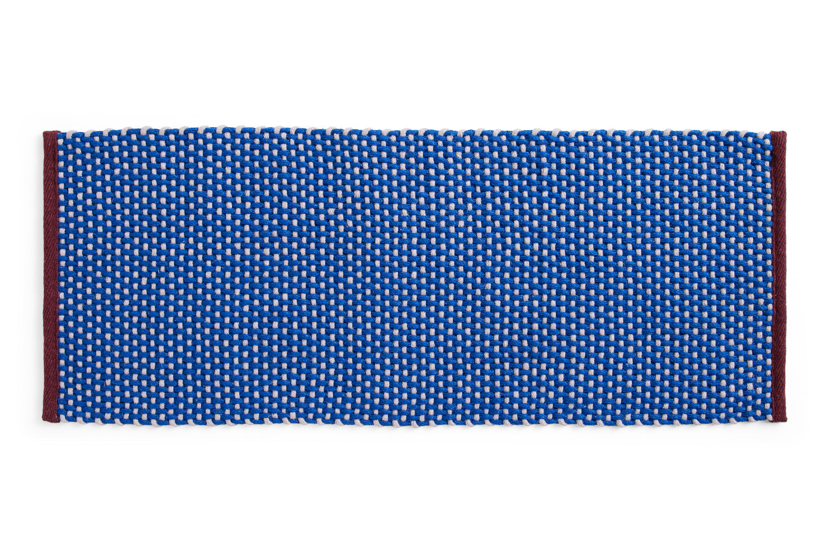 Royal blue long door mat rug by HAY with a textured surface, ideal for entryway decor and durability.