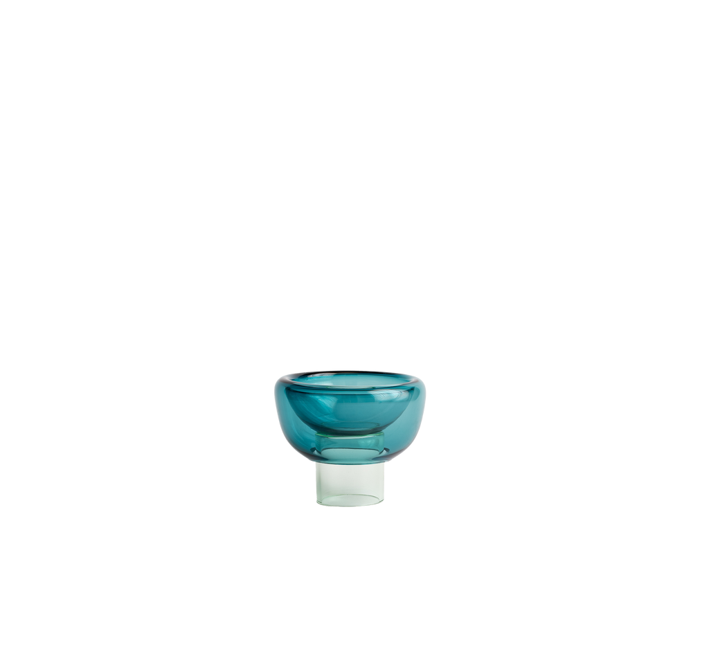 semi-transparent light mint blue cylinder glass base holding a semi-transparent a light cyan moon shape glass forming a bowl on a white background